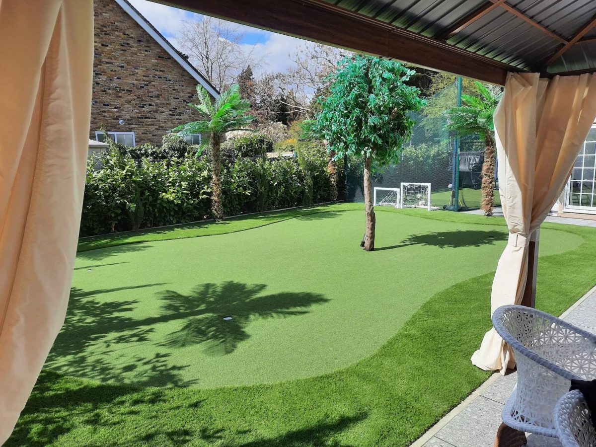 Artificial putting green viewed from outdoor gazebo