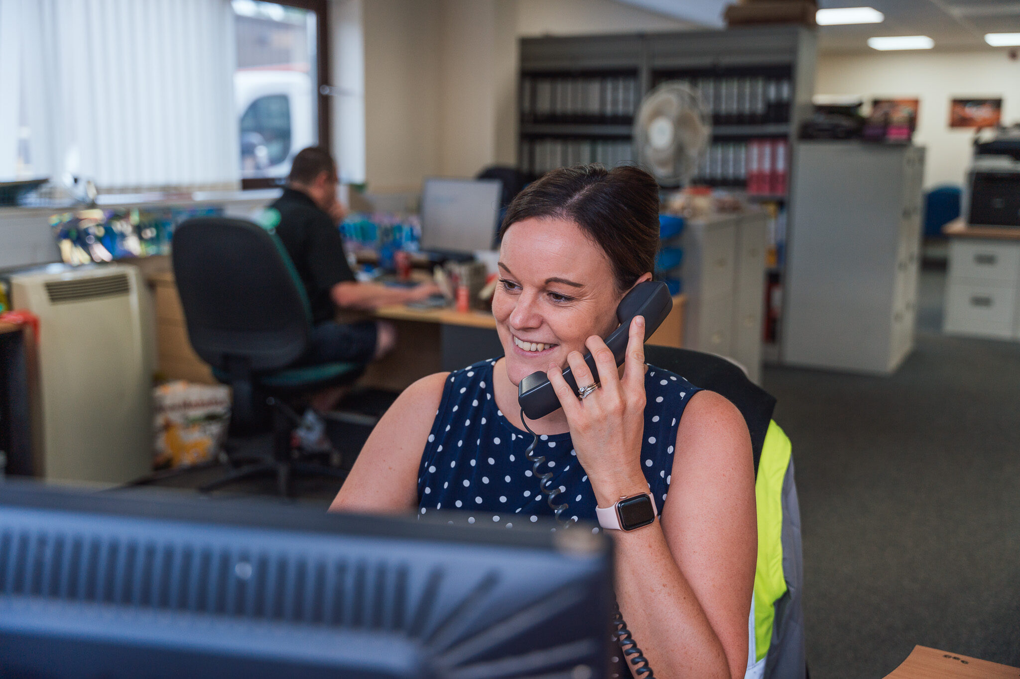 Office customer service taking a phone call